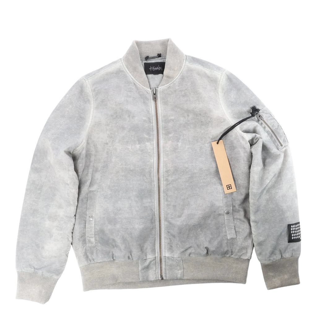 Ksubi gray overdye bomber jacket with zip-front closure, rib-knit collar and cuffs, sleeve zip pocket, and hanging tag on a white background.