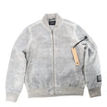 Ksubi gray overdye bomber jacket with zip-front closure, rib-knit collar and cuffs, sleeve zip pocket, and hanging tag on a white background.