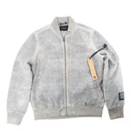 Ksubi gray overdye bomber jacket with zip-front closure, rib-knit collar and cuffs, sleeve zip pocket, and hanging tag on a white background.
