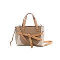 Beige and tan LOEWE Gate Mini leather handbag with top handles, knotted front strap, shoulder strap and gold-tone hardware.