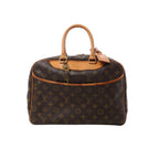 Louis Vuitton Deauville brown Monogram canvas handbag with natural leather handles, trim, curved front pocket and gold-tone hardware.