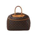 Louis Vuitton Deauville brown Monogram canvas handbag with natural leather handles, trim, curved front pocket and gold-tone hardware.