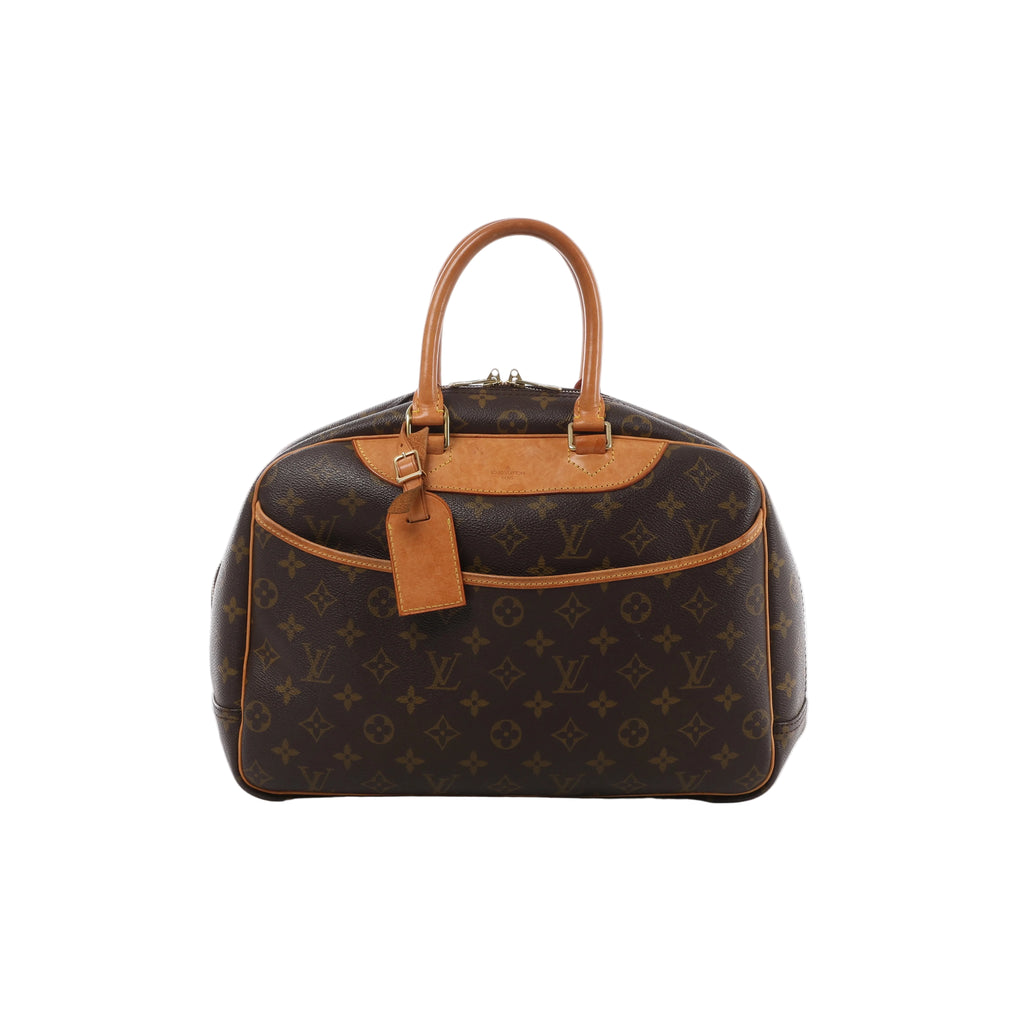 Louis Vuitton Deauville brown Monogram canvas handbag with natural leather handles, trim, curved front pocket and gold-tone hardware.
