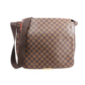Brown Louis Vuitton Bastille messenger bag in Damier Ebene checkered canvas with a wide shoulder strap, front flap and gold-tone hardware.
