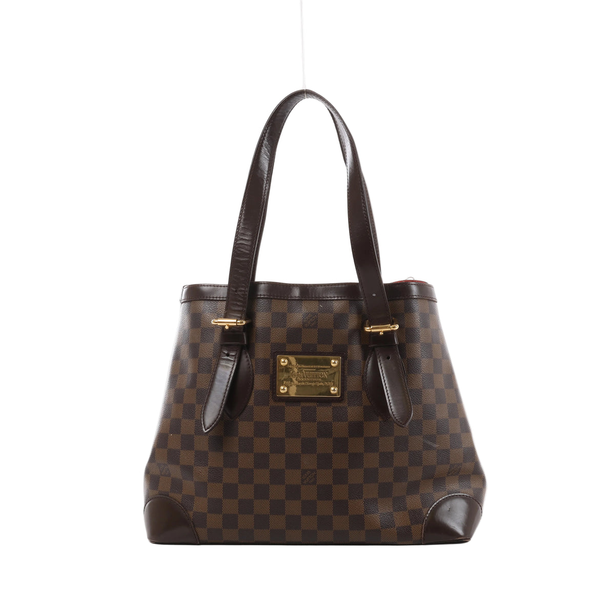 Brown Louis Vuitton Hampstead MM Damier Ebene shoulder bag with dark leather straps, reinforced corners and a gold-tone front nameplate.