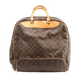Brown Louis Vuitton Evasion Monogram canvas travel bag with natural leather top handles, piping and a large front zip pocket.