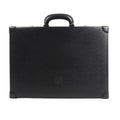 Loewe Anagram travel bag in black textured leather featuring a structured rectangular silhouette, top handle, reinforced leather corners, and embossed Anagram logo at the center, displayed against a white background.