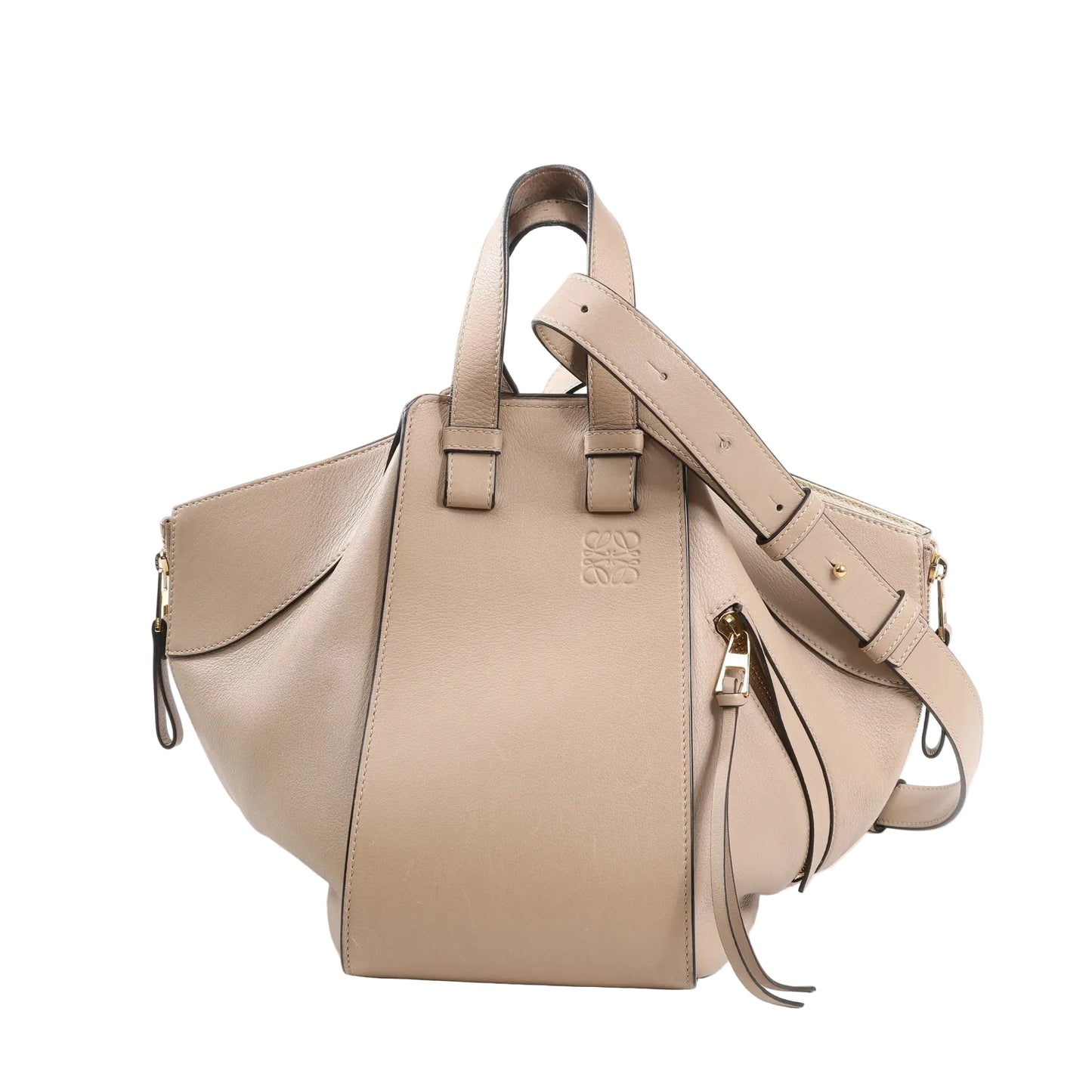 Front view of LOEWE Hammock Small 2Way Handbag in beige calfskin leather, featuring dual top handles, adjustable shoulder strap, gold-tone hardware, and side zip details.