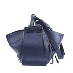 Blue leather backpack with a strap on a white background