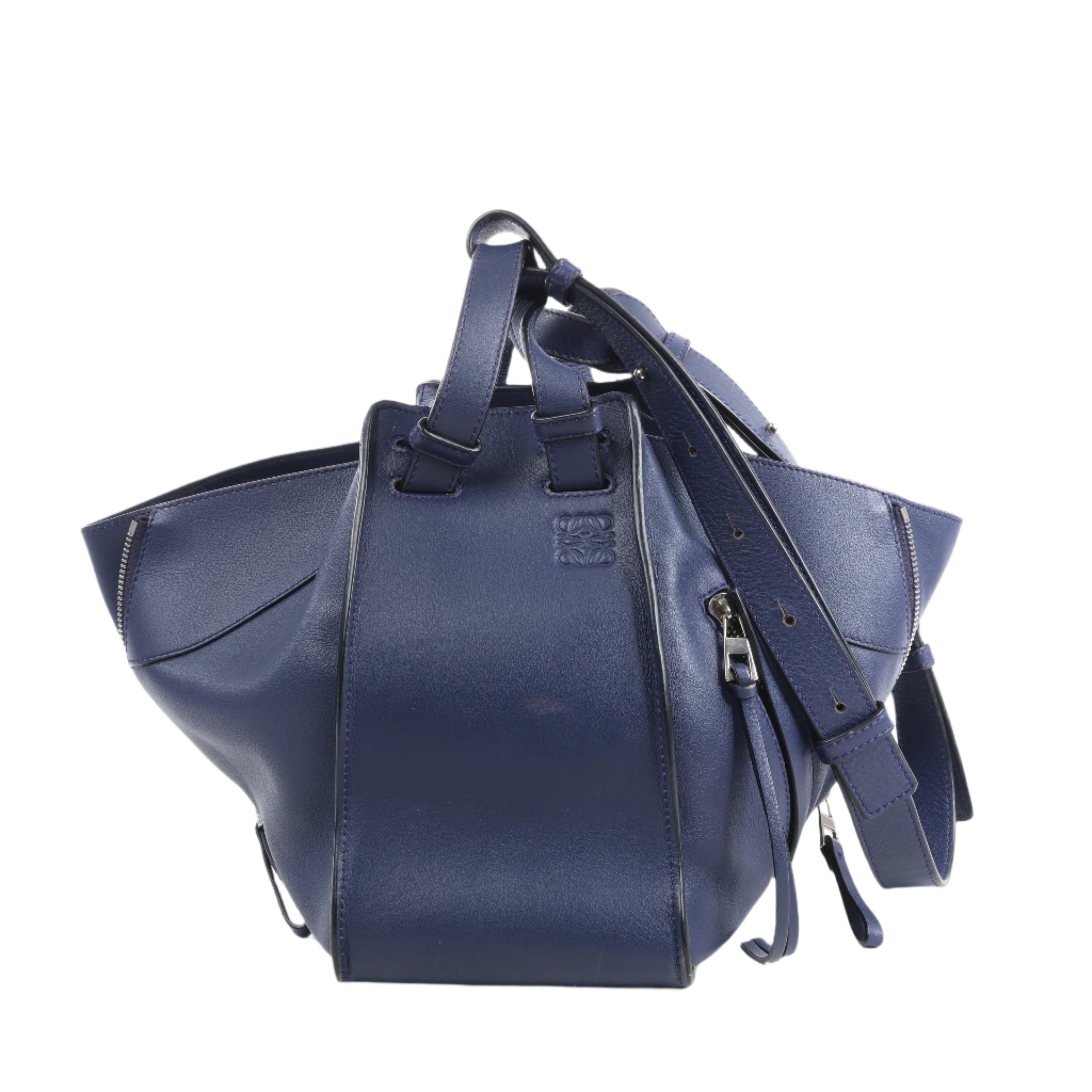 Blue leather backpack with a strap on a white background