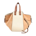 LOEWE Hammock Small Handbag in beige and brown leather with dual top handles, side zippers, gold-tone hardware, and sculptural expandable design against a white background.