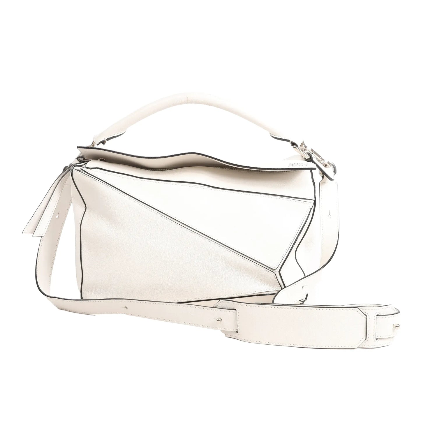 LOEWE Puzzle Medium 2Way handbag in white leather with angular geometric panels, top handle, and wide adjustable shoulder strap.