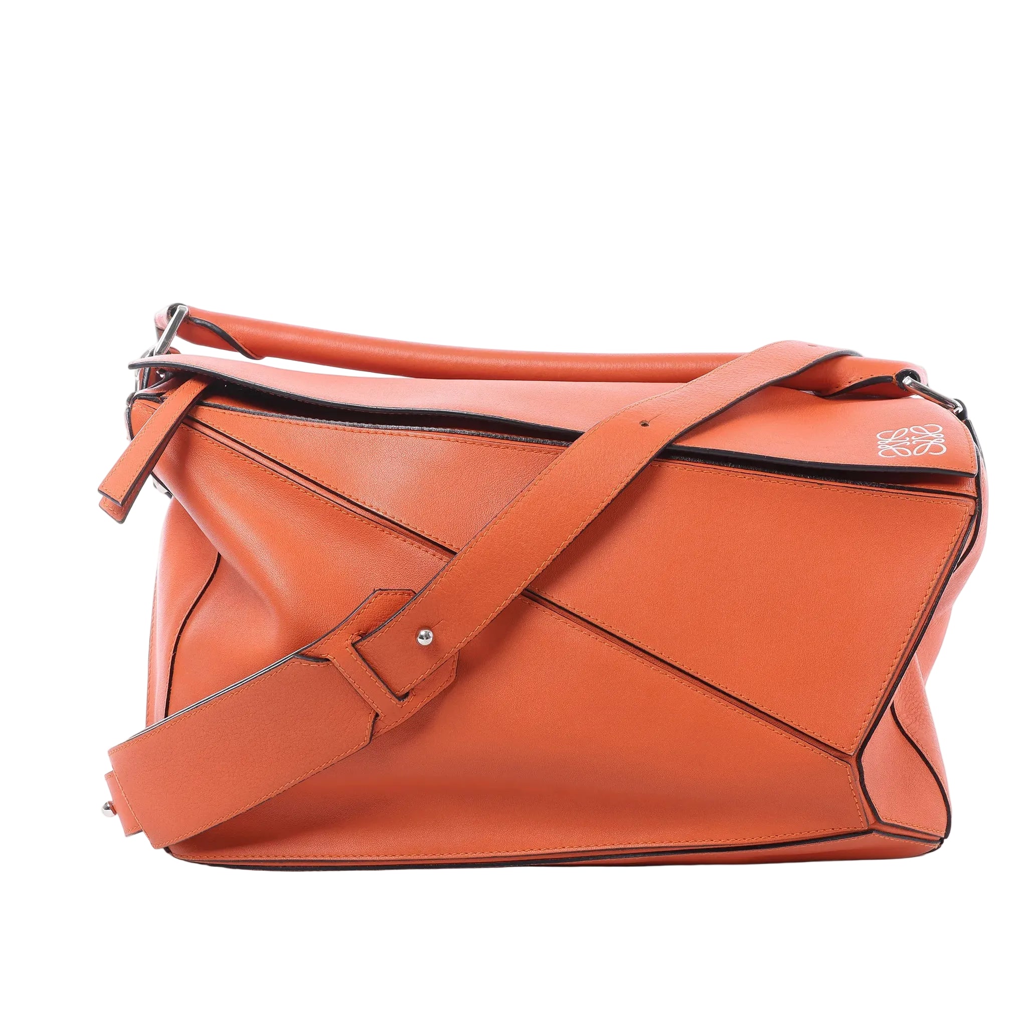 LOEWE Puzzle Large orange leather handbag with geometric panel design, top handle, wide shoulder strap, and white anagram logo detail on a white background.