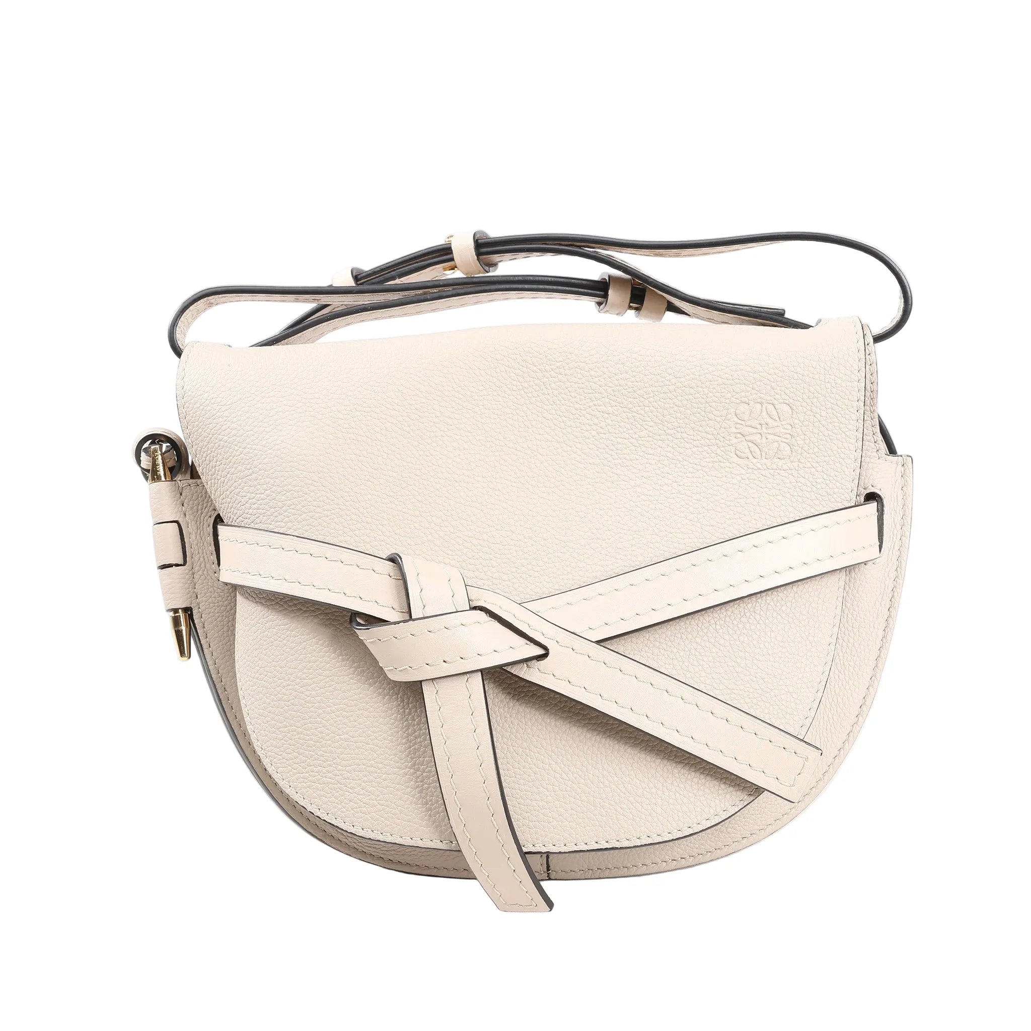 LOEWE Gate Soft Grain Leather Mini Crossbody Bag in beige with curved flap, knotted front strap detail, gold-tone hardware, and adjustable shoulder strap.