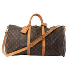 Louis Vuitton Keepall Bandoulière 55 travel bag in brown Monogram canvas with natural leather trim, dual handles, adjustable shoulder strap, and gold-tone hardware.