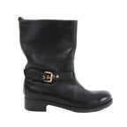 Side view of a black Louis Vuitton Susan leather boot with a rounded toe, low block heel and embossed ankle strap with a gold-tone buckle.
