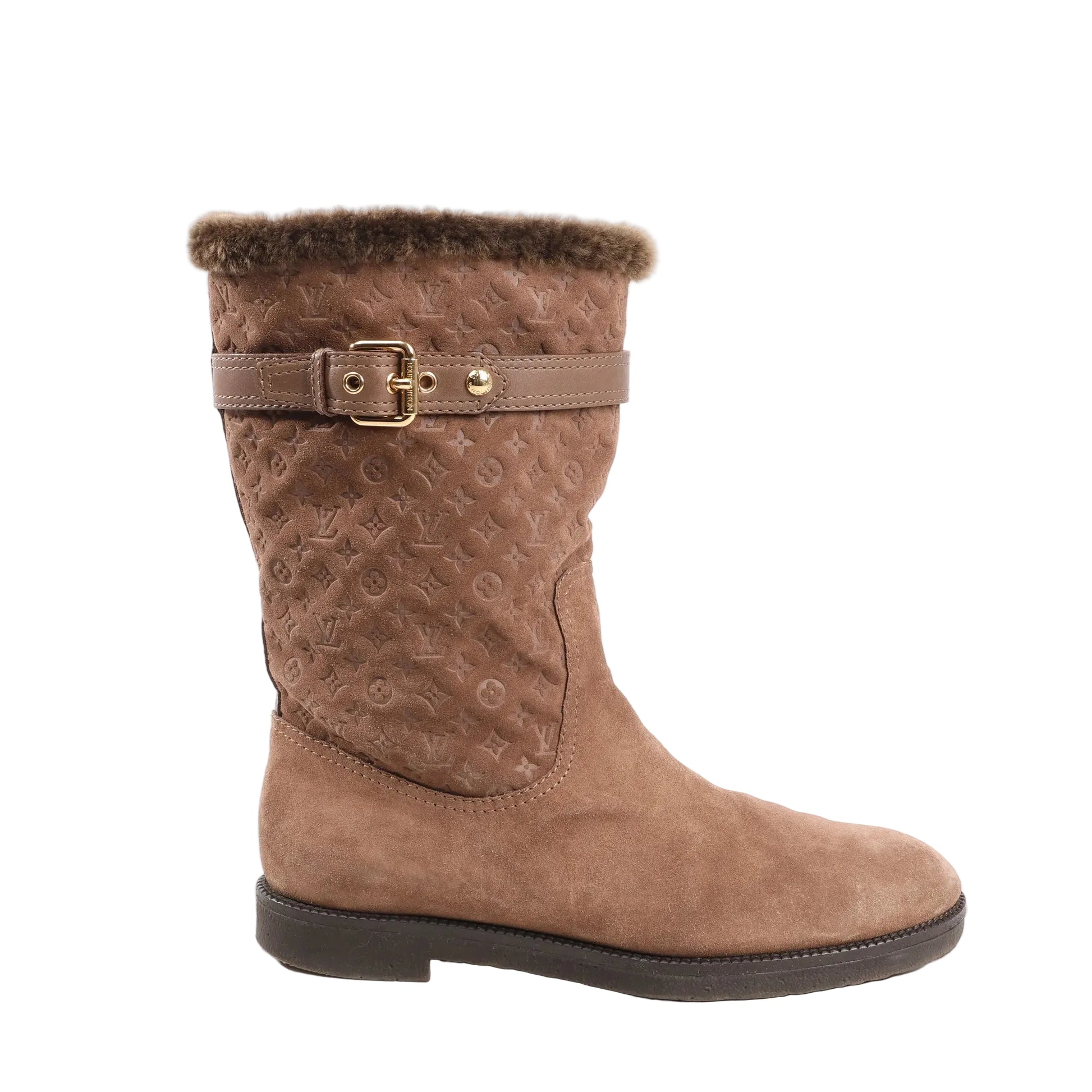 Louis Vuitton 11 Years boots in brown suede featuring a Monogram-embossed shaft, shearling-lined cuff, leather strap with gold-tone buckle, and flat black sole, shown in size 40 EU.