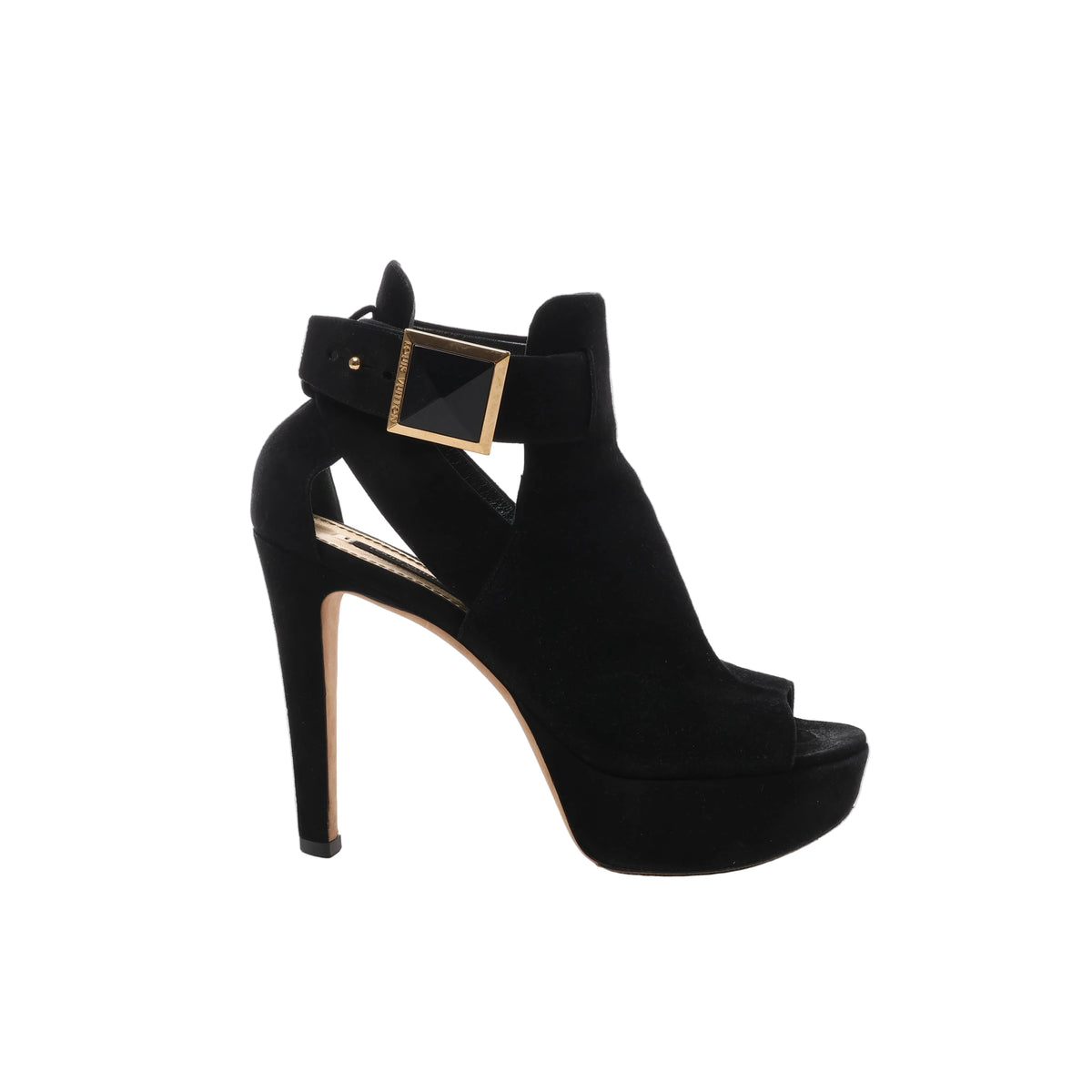 Side view of a Louis Vuitton black suede sandal with an open toe, raised platform, slender high heel and wide ankle strap with a gold-tone square buckle.