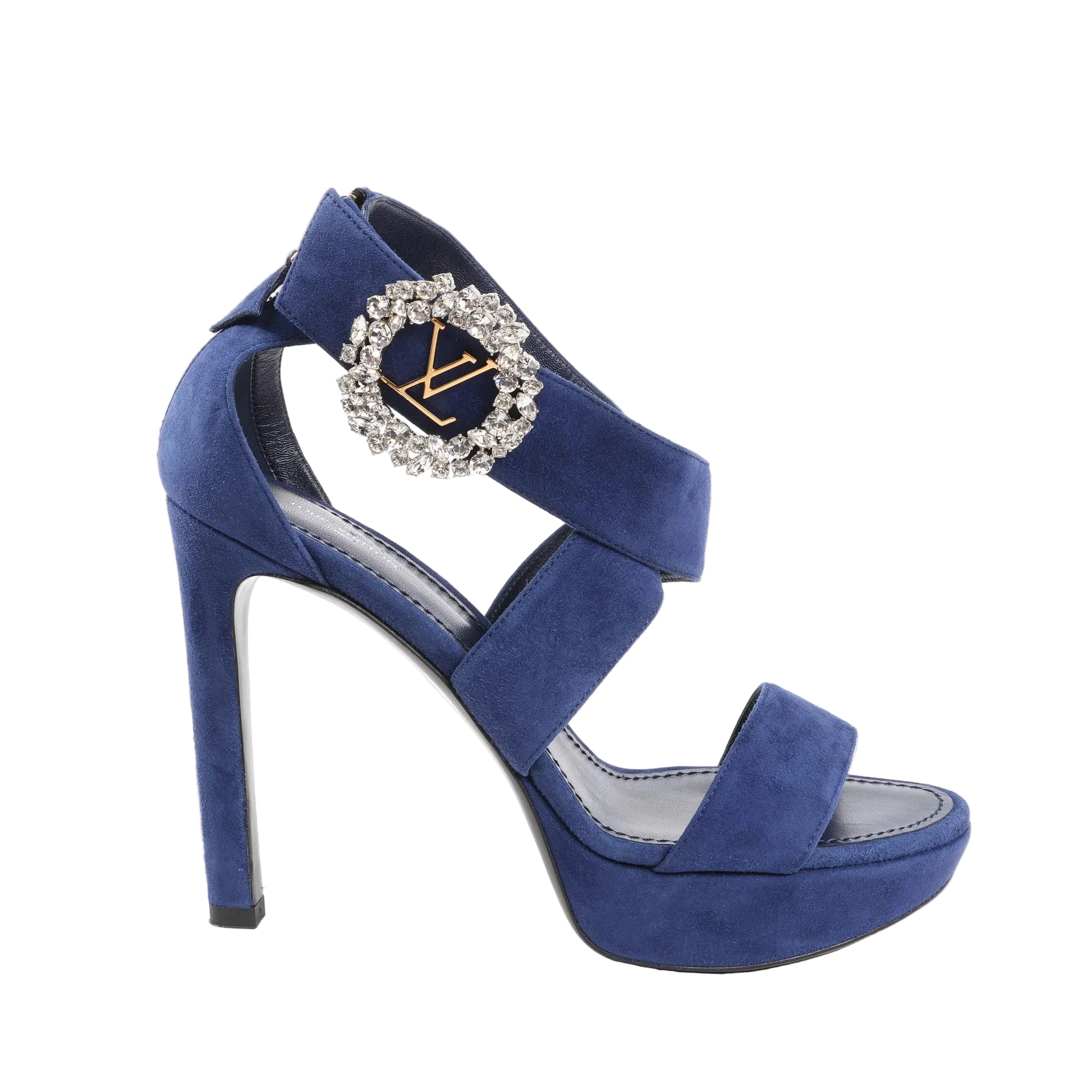 Louis Vuitton 19-Year high heels in navy blue suede featuring a platform sole, crisscross strap design, and a large round crystal-embellished buckle with gold LV logo. Size 38 EU.