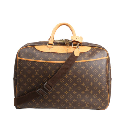 Louis Vuitton Alizé 2 Poches travel bag in brown Monogram Canvas featuring dual top handles, vachetta leather trim, two zippered compartments, a detachable shoulder strap, and gold-tone hardware.