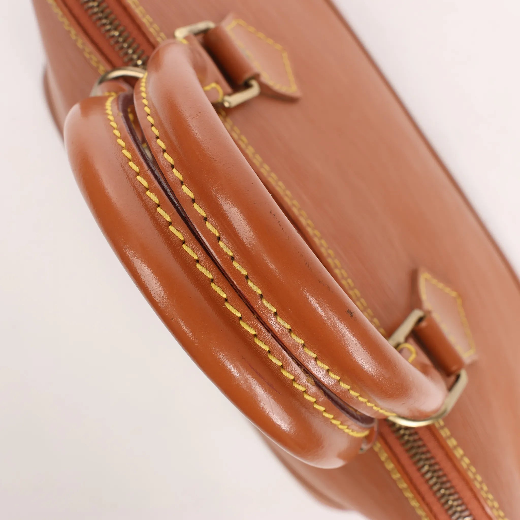 Louis Vuitton Alma PM Epi Leather Handbag in Brown