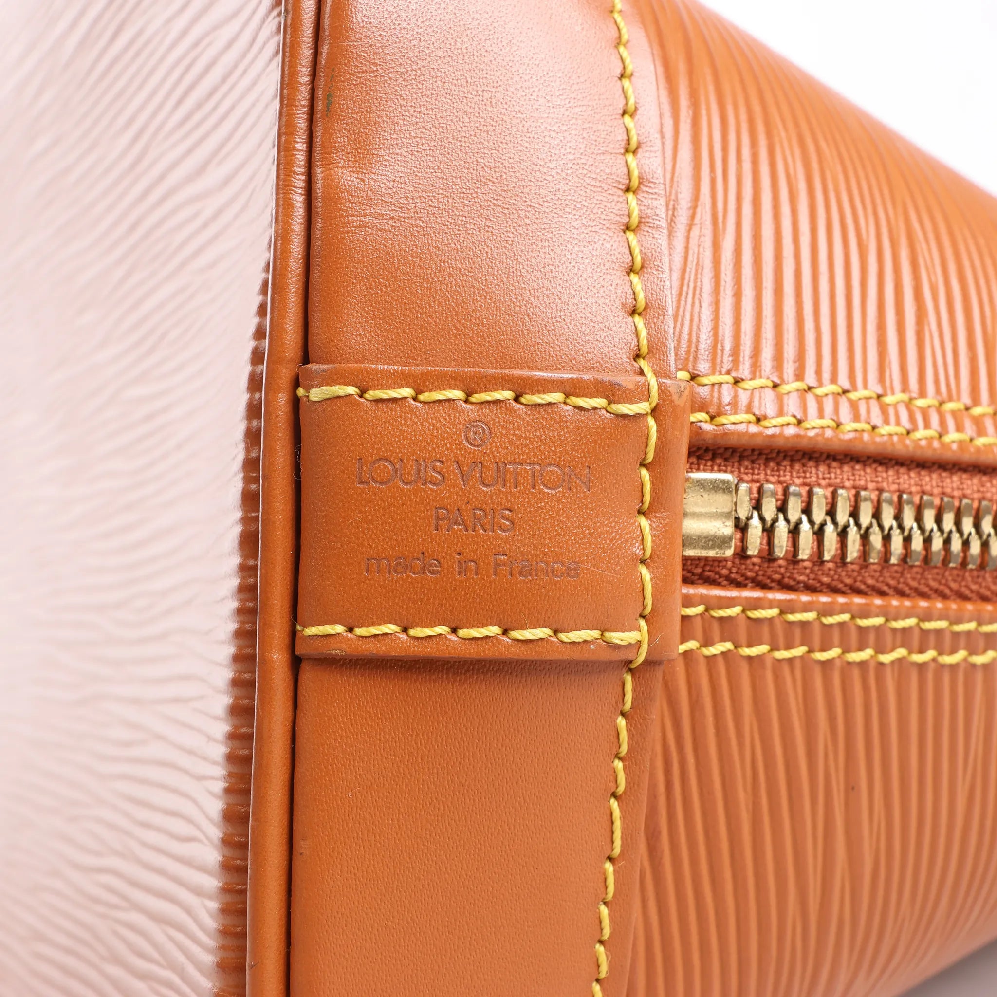 Louis Vuitton Alma PM Epi Leather Handbag in Brown
