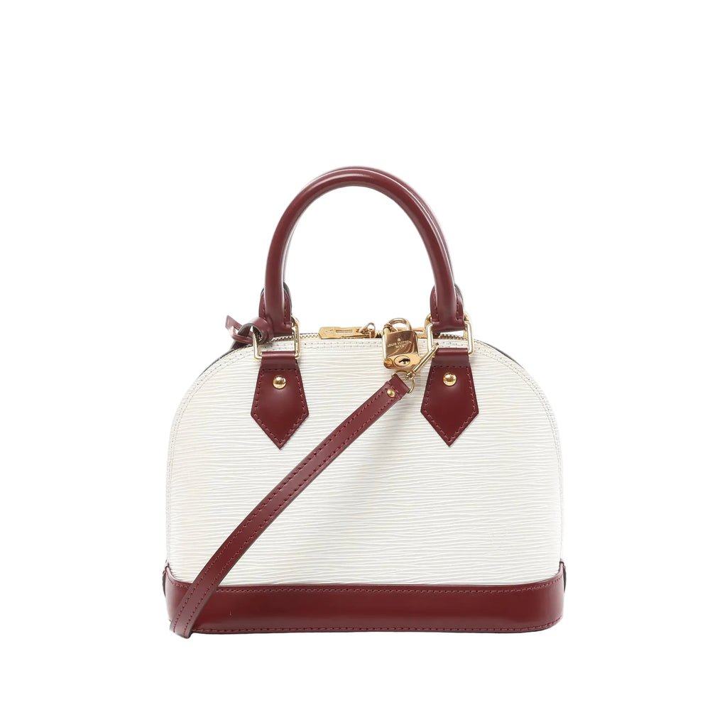 Louis Vuitton Alma BB white Epi leather handbag with burgundy leather trim, top handles, detachable shoulder strap, and zip-top closure, front view on white background.