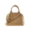 Louis Vuitton Alma BB handbag in gold Monogram Vernis with rolled top handles, detachable shoulder strap, luggage tag and gold-tone hardware.