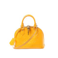 Yellow Louis Vuitton Alma BB Monogram Vernis patent leather handbag with embossed monogram, top handles, detachable shoulder strap, and padlock at the top zip.