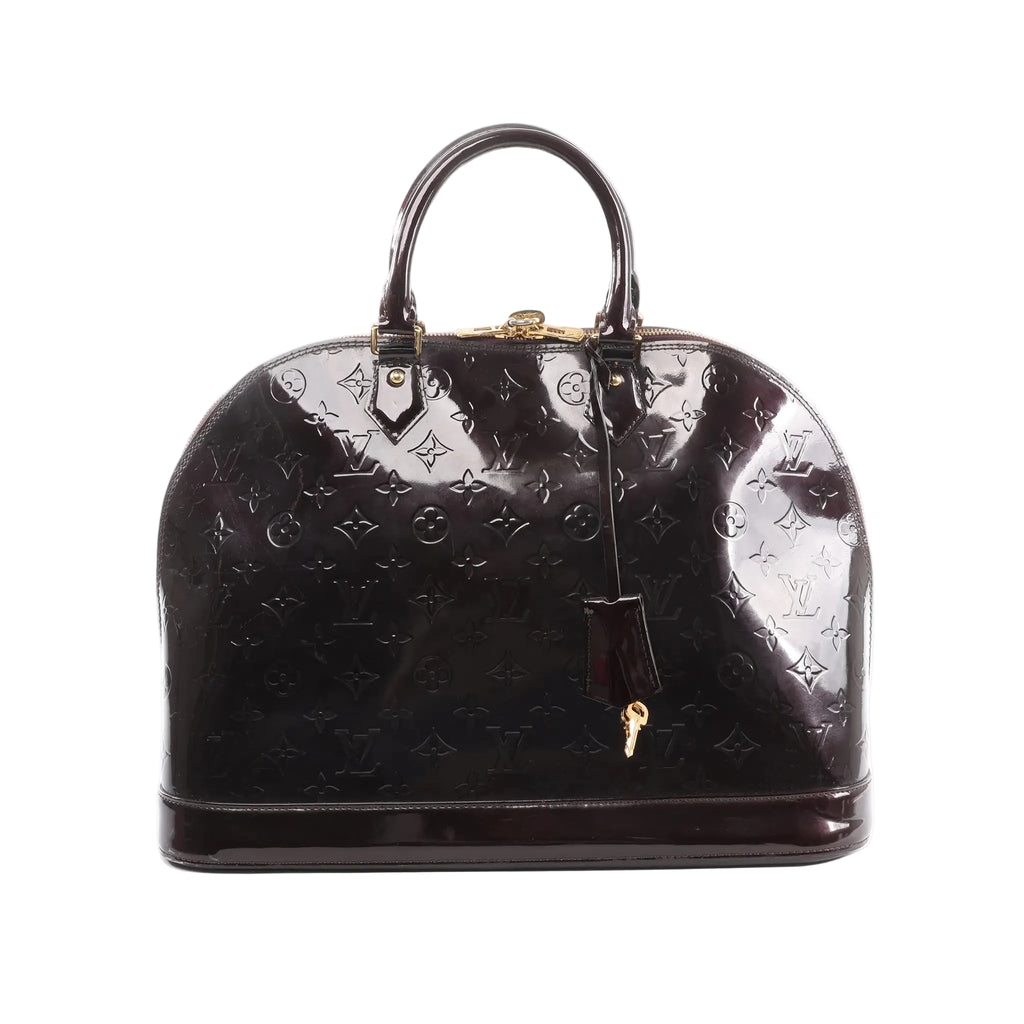 Louis Vuitton Alma GM handbag in glossy burgundy Vernis leather with embossed Monogram, double top handles, zip-top closure, and leather clochette with key, front view on white background.