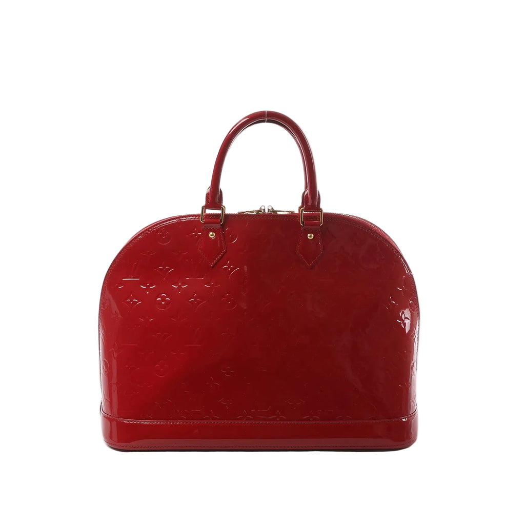 Louis Vuitton Alma GM handbag in glossy red Vernis leather with embossed Monogram pattern, rolled top handles, and gold-tone hardware.