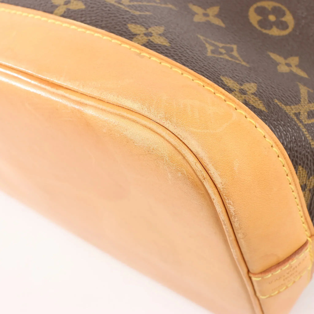 Louis Vuitton Monogram Canvas Alma PM Handbag in Brown M51130