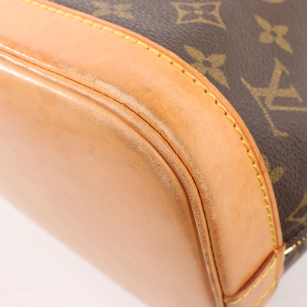 Louis Vuitton Monogram Canvas Alma PM Handbag in Brown M51130