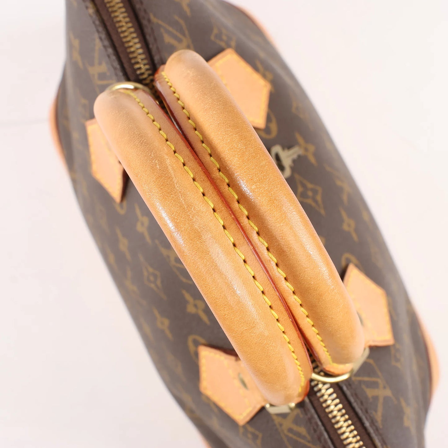 Louis Vuitton Monogram Canvas Alma PM Handbag in Brown M51130