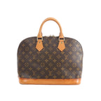Louis Vuitton Alma PM handbag in brown Monogram canvas with tan leather top handles and vachetta leather base on white background