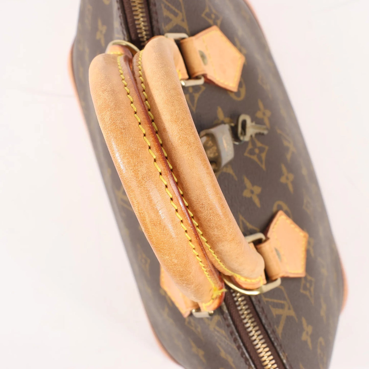 Louis Vuitton Monogram Canvas Alma PM Handbag in Brown M51130