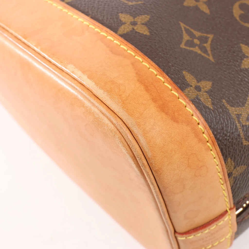 Louis Vuitton Monogram Canvas Alma PM Handbag in Brown M51130