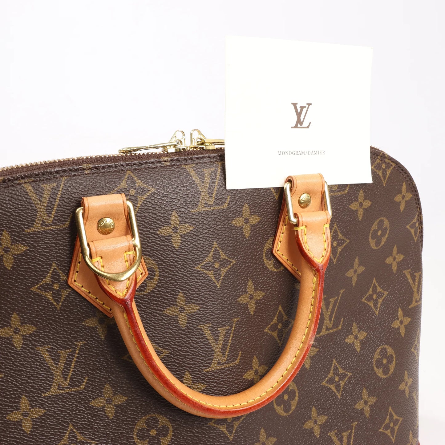 Louis Vuitton Monogram Canvas Alma PM Handbag in Brown M51130