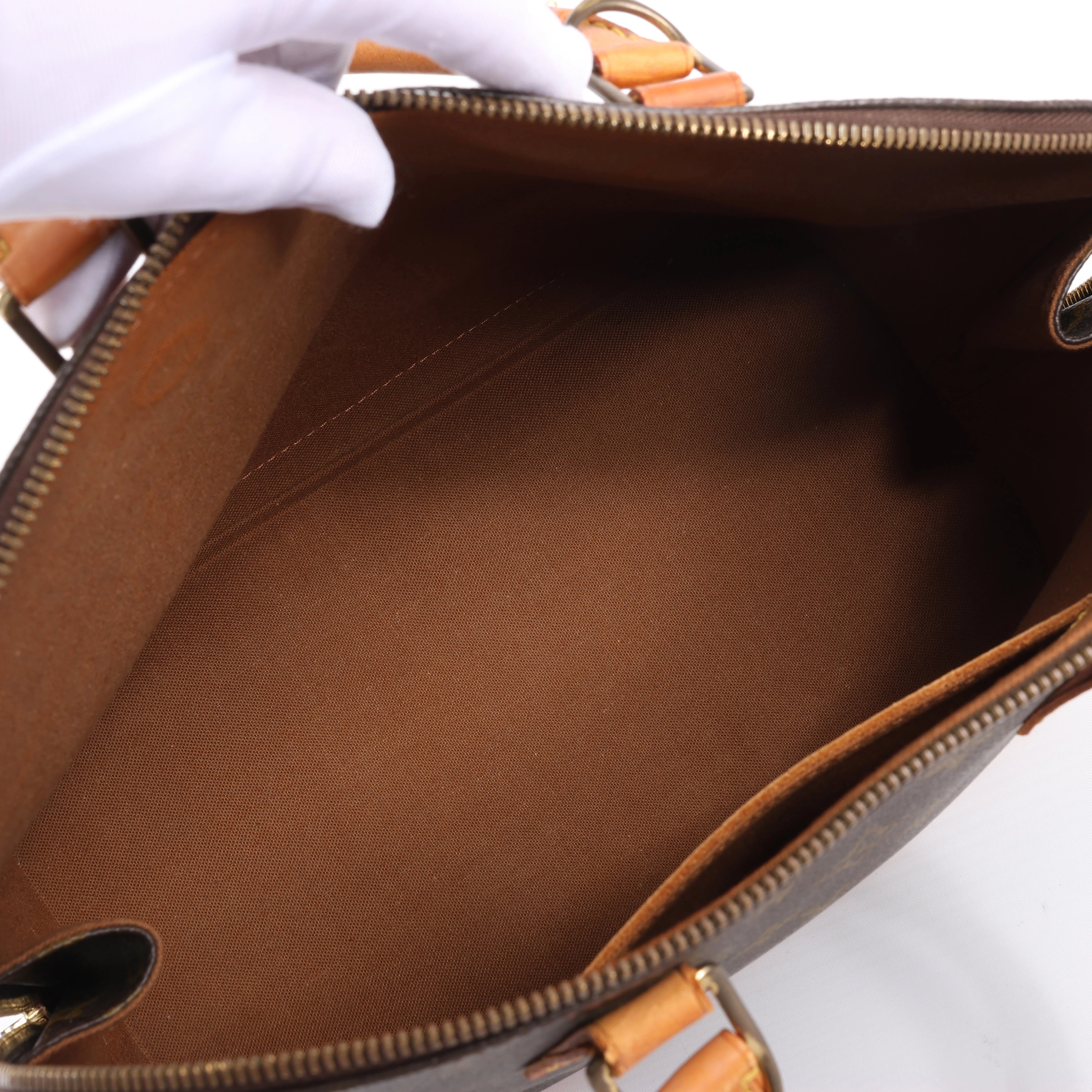 Louis Vuitton Alma Monogram Canvas Handbag in Brown M51130
