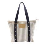 Louis Vuitton Antigua Cabas MM tote in blue-and-cream striped canvas with navy handles, gold-tone studs and a rectangular logo plaque