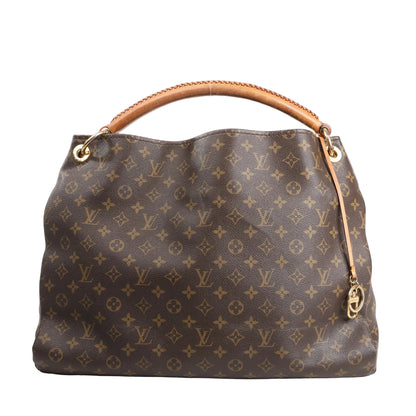 Louis Vuitton Artsy GM shoulder bag in brown Monogram canvas featuring the signature LV and floral pattern, braided leather handle, and gold-tone hardware accents.