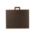 Louis Vuitton Bisten rectangular case in brown Monogram canvas with tan leather trim, a top handle and metal corner protectors.