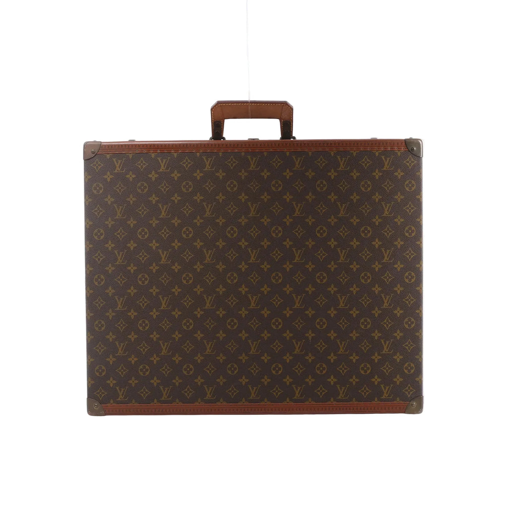 Louis Vuitton Bisten rectangular case in brown Monogram canvas with tan leather trim, a top handle and metal corner protectors.
