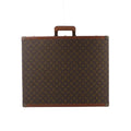 Louis Vuitton Bisten rectangular case in brown Monogram canvas with tan leather trim, a top handle and metal corner protectors.