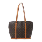 Louis Vuitton Babylone shoulder bag in brown Monogram canvas with tan vachetta leather straps, gold-tone hardware, and structured tote silhouette on white background.