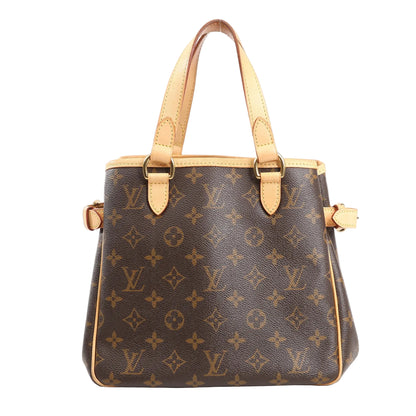 Louis Vuitton Batignolles shoulder bag in brown Monogram canvas with natural leather handles, gold-tone hardware, and adjustable side buckles.