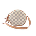 Louis Vuitton Boite Chapeau Souple Damier Azur round crossbody bag in beige checkered canvas with vachetta leather trim, top zipper, and adjustable vachetta leather shoulder strap, shown on a white background.