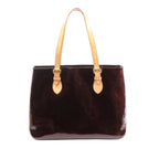 Amarante purple Louis Vuitton Brentwood Vernis leather tote with embossed Monogram pattern, natural leather shoulder straps and gold-tone buckles.
