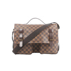 Louis Vuitton Broadway messenger bag in brown Damier Ebene check canvas with flap closure, two front pockets, and adjustable crossbody strap on white background