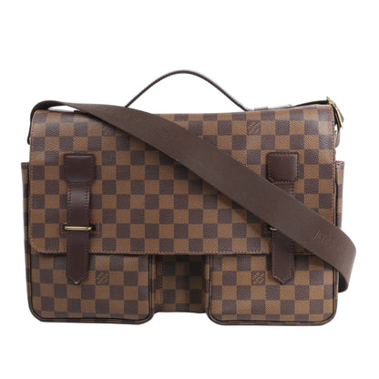 Louis Vuitton Broadway shoulder bag N42270 in Damier Ebene brown checkered canvas with dark leather trim, dual front pockets, flap closure, and wide adjustable strap against a white background.
